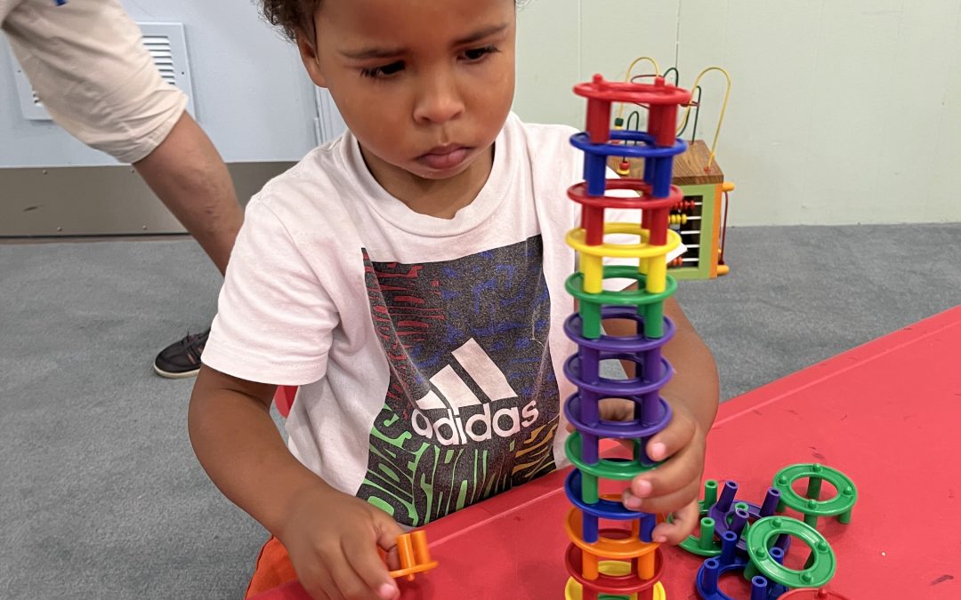 child playing with educational toy