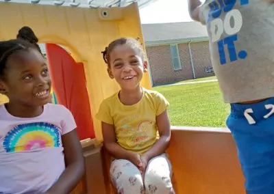 Preschoolers playing and contact toy house